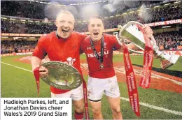  ??  ?? Hadleigh Parkes, left, and Jonathan Davies cheer Wales’s 2019 Grand Slam