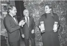  ?? EVAN AGOSTINI/INVISION/AP ?? Leonardo DiCaprio, left, Robert De Niro and Lily Gladstone with prizes won for “Killers of the Flower Moon” on Nov. 27 at the Gotham Awards.