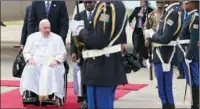  ?? (AFP) ?? Pope Francis (left), seated on a wheelchair, arrives at the N’djili Internatio­nal Airport in Kinshasa, Democratic Republic of Congo (DRC), on Tuesday.