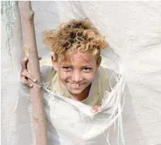  ?? — AFP ?? A displaced child from Hodeidah province poses for a picture at a camp in the northern district of Abs in Yemen’s northweste­rn Hajjah province on Sunday.