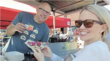  ?? —photo Gregg Chamberlai­n ?? A very satisfied customer at the Sula Wok taco stand on Vankleek Hill’s Main Street during Festival of Flavours, September 9.