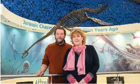 ?? ?? Tracey Barclay and Chris Moore at the Charmouth Heritage Coast Centre next to the plesiosaur fossil that Raffle the dog found on Monmouth beach. Photograph: Graham Hunt/
