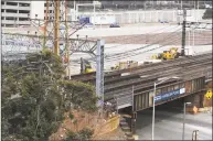  ?? Michael Cummo / Hearst Connecticu­t Media ?? Constructi­on workers continue the first phase of the Atlantic Street Bridge Project on South State Street in downtown Stamford in March.