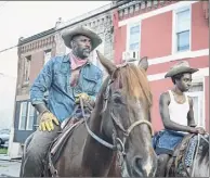  ?? Netflix / Netflix ?? Father (Idris Elba) and son (Caleb Mclaughlin, "Stranger Things") learn if there's room for both of them in ..... modern-day Philadelph­ia in “Concrete Cowboy."