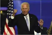  ?? ANDREW HARNIK — THE ASSOCIATED PRESS FILE ?? Then-President-elect Joe Biden gestures to supporters on Nov. 7, 2020, in Wilmington, Del.