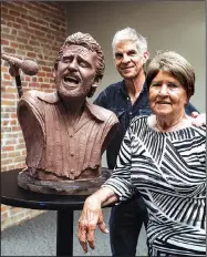 ?? Arkansas Democrat-Gazette/MITCHELL PE MASILUN ?? Kevin Kresse (center) and Anna Lee Amsden pose with a bust of the late musician Levon Helm on Wednesday.