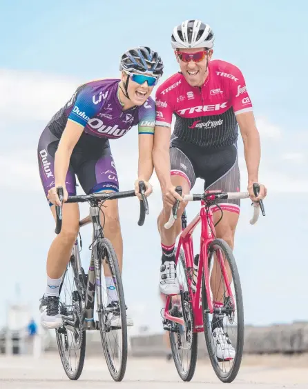  ?? Picture: JASON EDWARDS ?? Cyclists Macey Stewart and Koen de Kort are celebratin­g what’s ahead for the Jayco Herald Sun Tour.