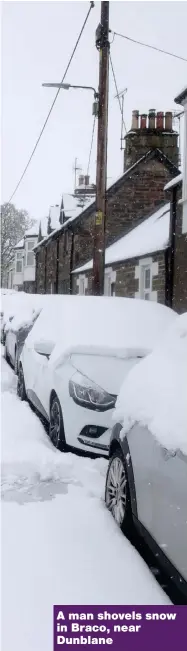  ??  ?? A man shovels snow in Braco, near Dunblane