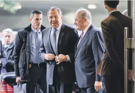  ?? AFP ?? Russian Foreign Minister Sergey Lavrov, centre, arrives for a meeting with UN Syria envoy Staffan de Mistura and foreign ministers of Turkey and Iran at the UN offices in Geneva yesterday