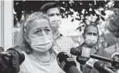  ?? Salvador Melendez / Associated Press ?? Rosibel Emerita Arriaza, whose daughter died in police custody, addresses reporters in El Salvador.