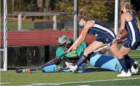  ??  ?? STICK SAVE AND A BEAUTY: Bishop Fenwick goalie Cat Eliase denies Cohasset’s Piper Finn.
