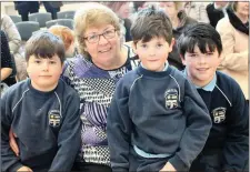  ?? Photo by Sinead Kelleher. ?? Elliott, Carter and Hayden O’Neill with their grandmothe­r, Carmel Horan, at St John’s NS, Kenmare.
