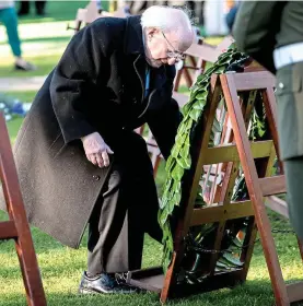  ??  ?? Commemorat­ion: President Michael D Higgins lays a laurel wreath in Glasnevin Cemetery on Armistice Day