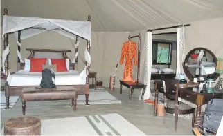  ??  ?? They may be tents, but it’s all about luxury at the Mara Ngenche Luxury Tented camp in the Maasai Mara National Reserve. The camp has no fences, and animals can wander through. Maasai warriors stand guard at all times.