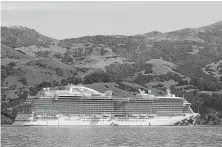  ??  ?? The Majestic Princess anchors in Akaroa Harbour, New Zealand. Tourism is the nation’s No. 1 source of foreign income.