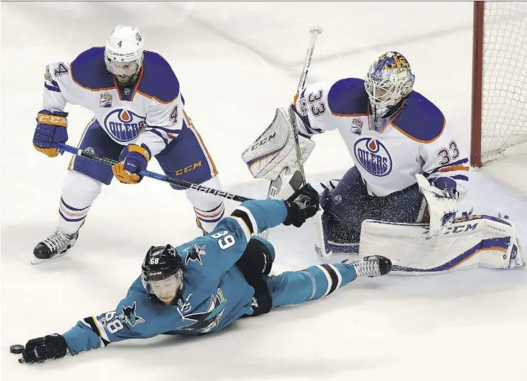  ??  ?? Goalie Cam Talbot believes Kris Russell and the rest of the Oilers have been strengthen­ed by the challenges they faced while dumping Melker Karlsson’s Sharks in the first round.