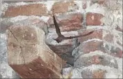  ?? Allen J. Schaben Los Angeles Times ?? A NORTHERN rough-winged swallow f lies from a crevice at the mission’s Great Stone Church in 2012.