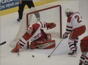  ?? BY JOE BOYLE JBOYLE@DIGITALFIR­STMEDIA.COM @BOYLERALER­TTROY ON TWITTER ?? Linden Marshall tries to disrupt a pass on January 10 at the Houston Field House as RPI fell to Cornell, 3-0.