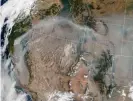  ??  ?? A satellite image shows smoke plumes from the California wildfires migrating across the American west. Photograph: Nasa/AFP/Getty Images