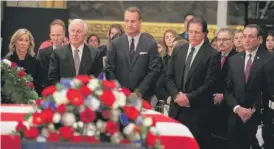  ?? MANUEL BALCE CENETA/AP ?? From left, sports greats Chris Evert, Hale Irwin, Peyton Manning, Phil Mickelson and Mike Krzyzewski pay respects to George H.W. Bush on Tuesday.