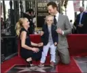  ?? CHRIS PIZZELLO, THE ASSOCIATED PRESS ?? Chris Pratt, right, his wife, Anna Faris and their son Jack on the Hollywood Walk of Fame.