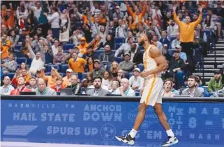  ?? TENNESSEE ATHLETICS PHOTO ?? Tennessee senior guard Josiah-Jordan James lets the fans celebrate after his 3-pointer just before halftime in last Thursday’s 70-55 triumph over Ole Miss in the Southeaste­rn Conference tournament in Nashville.