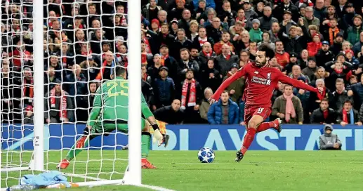  ?? AP ?? Mohamed Salah scores for Liverpool in their crucial 1-0 win over Napoli in a Champions League Group C match at Anfield.