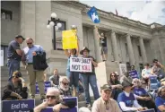  ?? Tamir Kalifa / New York Times ?? Demonstrat­ors protest the death penalty Friday outside the Arkansas state Capitol in Little Rock.