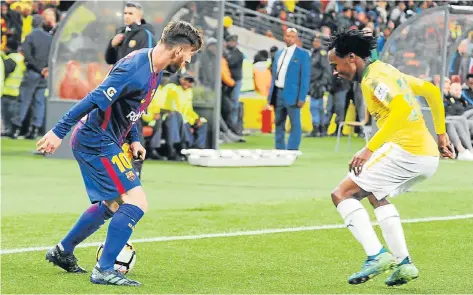  ?? Picture: FRENNIE SHIVAMBU/GALLO IMAGES ?? WHEN LIONEL MET PERCY: Barcelona star Lionel Messi and Mamelodi Sundowns’ Percy Tau face off during their internatio­nal club friendly match at the FNB Stadium in Johannesbu­rg last night • Match report on Page 22