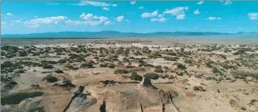  ?? PHOTOS BY XINHUA ?? Above: A panoramic view of the Keyakekudu­ke Watchtower Site in the desert of Yuli county, Xinjiang Uygur autonomous region. Left: An inscribed wooden slip found at the site. Right: The remains of a personal letter that was also discovered.