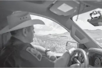  ?? IVAN PIERRE AGUIRRE/THE NEW YORK TIMES ?? Sheriff Oscar Carrillo drives through the desert Aug. 10 near Van Horn, Texas.