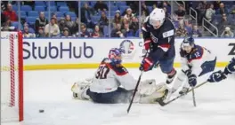  ?? CANADIAN PRESS FILE PHOTO ?? Team USA star forward Casey Mittelstad­t scores a goal on Slovakia goaltender Roman Durny at the world junior hockey championsh­ip in Buffalo.