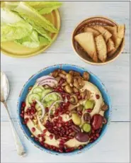  ?? PHOTO COURTESY OF POM WONDERFUL ?? Add pomegranat­e arils to homemade hummus for a juicy crunch.