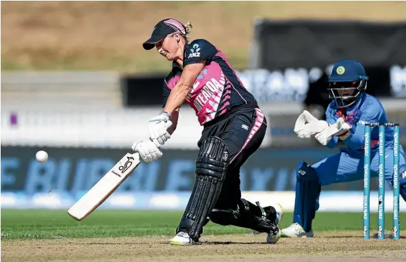 ?? PHOTOSPORT ?? White Ferns opening bat Sophie Devine strikes a lofted drive on her way to 72 from 52 balls against India in Hamilton yesterday.