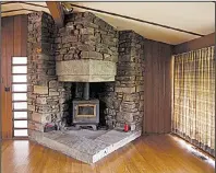  ?? Democrat-Gazette file photo ?? This fireplace is one of the few things that can be salvaged after a fire recently engulfed a home in Fayettevil­le that was designed by architect E. Fay Jones and was once lived in by former President Bill Clinton.