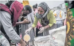  ?? ?? DESPERATE MEASURES: An emergency food distributi­on centre in Ethiopia’s Tigray region.