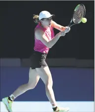  ?? Scott Barbour / Getty Images ?? Simona Halep plays a shot during a practice session ahead of the Australian Open at Melbourne Park on Friday.