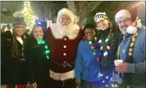  ?? COURTESY OF DIANE MCNITT ?? Celebratin­g with Santa after Lansdowne’s annual tree lighting, “Illuminate the Avenue” winter lights parade, Santa’s visit, and the town’s first winter market sponsored by the Lansdowne Business & Profession­al Associatio­n are, from left, state
Rep. Gina H. Curry, D-164; Lansdowne’s Mayor Magda Bryne; Lansdowne Business & Profession­al Associatio­n President Tiara Austin; associatio­n member Julia Prymak; and borough council President Benjamin Hover. The event organizer and board member was Beth Harmer.