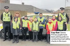  ??  ?? Cop that Denny Primary pupils have been joining police in conducting road safety checks in the town