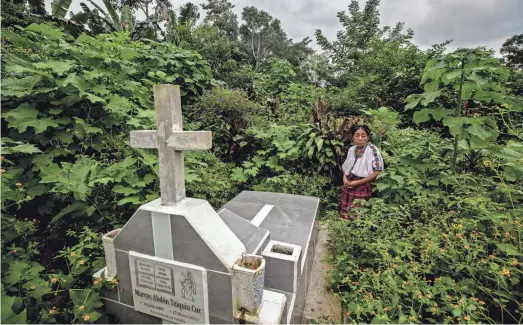  ?? OMAR ORNELAS/ EL PASO TIMES ?? Juana Cuc visits the grave of her son, Marcos Abdon Tziquin Cuc, who left his Mayan village in Guatemala in hopes of working in the U.S. He was detained by Mexican authoritie­s on the outskirts of Juárez and transferre­d to a migrant detention center where he died in a March 27, 2023, fire. Forty migrants lost their lives.