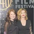  ?? Andy Colwell, Special to The Denver Post ?? Denver Film Festival director Britta Erickson, left, with Kyra Sedgwick.