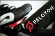  ?? JEFF CHIU — THE ASSOCIATED PRESS FILE ?? Peloton’s logo on one of its exercise bikes. The company’s loss widened in its fiscal third quarter and sales continued to slow as the company contends with a further cooling of the exercise-at-home trend. Shares fell sharply Tuesday.