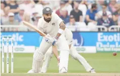  ??  ?? India’s captain Virat Kohli plays a shot during the third day of the third Test cricket match between England and India at Trent Bridge in Nottingham, central England. — AFP photo