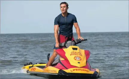  ?? Baywatch. ?? Zac Efron stars as Matt Brody, a disgraced Olympic swimmer turned lifeguard, in