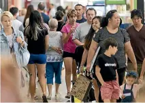  ??  ?? Shoppers queued outside Westfield Albany stores before they opened at 10am yesterday.