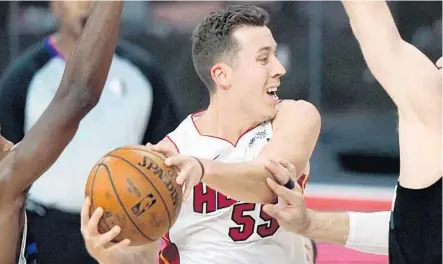  ?? MARK J. TERRILL/AP ?? Those James Harden rumors? They were back briefly for the Heat’s Duncan Robinson.