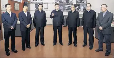  ?? Lan Hongguang New China News Agency ?? FLANKED by his top lieutenant­s, Xi Jinping, center, visits a museum in 2012 after rising to China’s top post. That visit would provide a glimpse of Xi’s ambition to resurrect the greatness of China’s more glorious past.