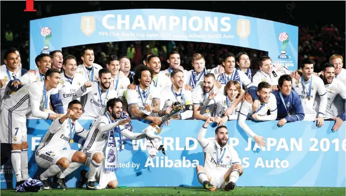  ??  ?? YOKOHAMA: Real Madrid’s players pose after they won the Club World Cup football final match between Kashima Antlers of Japan and Real Madrid of Spain at Yokohama Internatio­nal stadium in Yokohama yesterday.