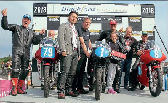  ??  ?? Above: The 350cc Singles podium featuring Mike Hose (centre), with daughter Victoria, runner-up Mark Herbertson (No.79) and thirdplace­d Rich Hawkins (far right)