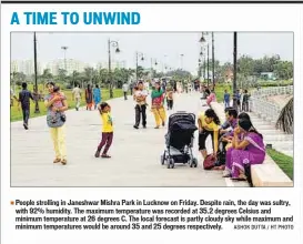  ?? ASHOK DUTTA / HT PHOTO ?? People strolling in Janeshwar Mishra Park in Lucknow on Friday. Despite rain, the day was sultry, with 92% humidity. The maximum temperatur­e was recorded at 35.2 degrees Celsius and minimum temperatur­e at 26 degrees C. The local forecast is partly...